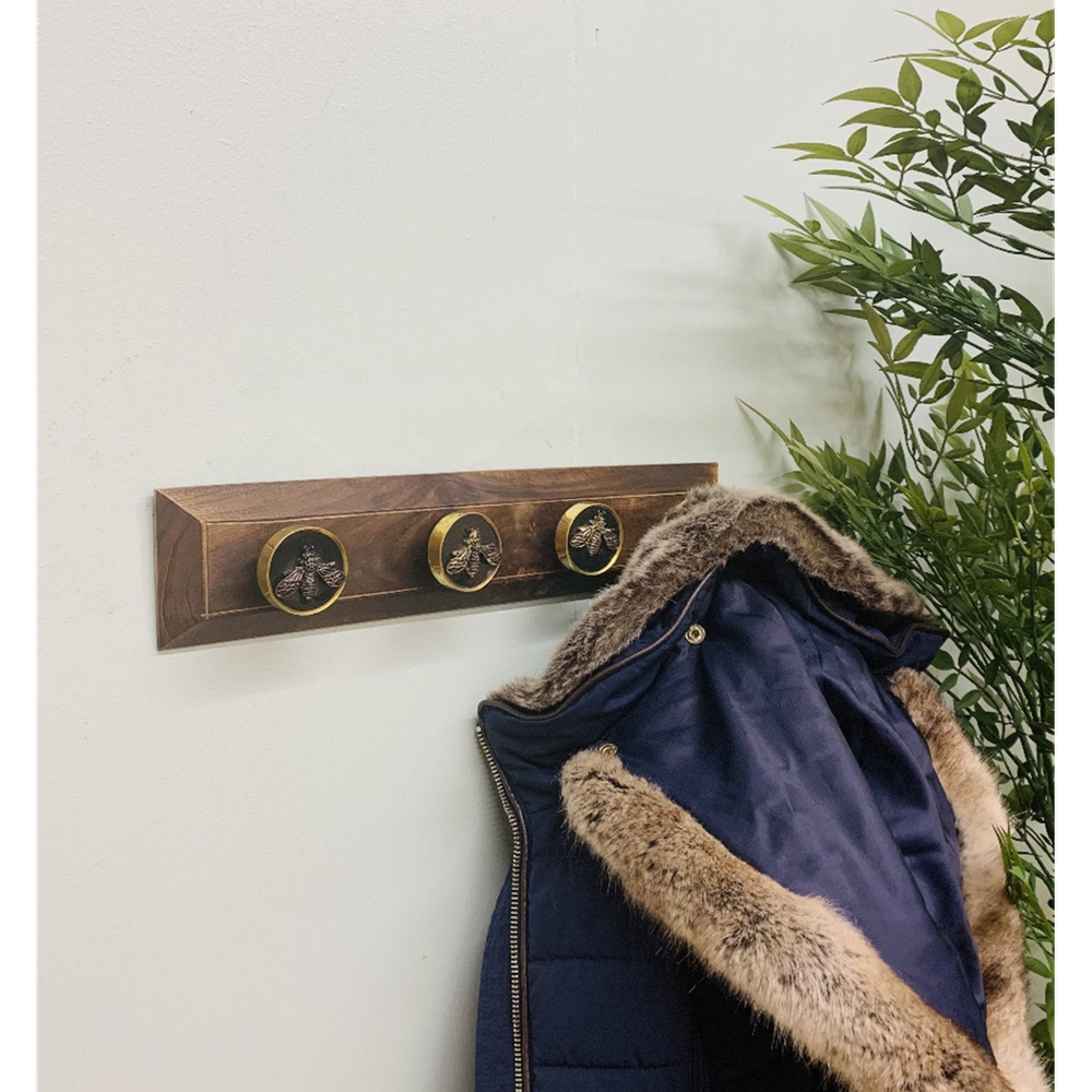 Four Bee Design Coat Knobs On A Wooden Base