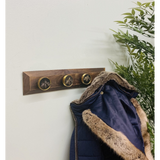 Four Bee Design Coat Knobs On A Wooden Base